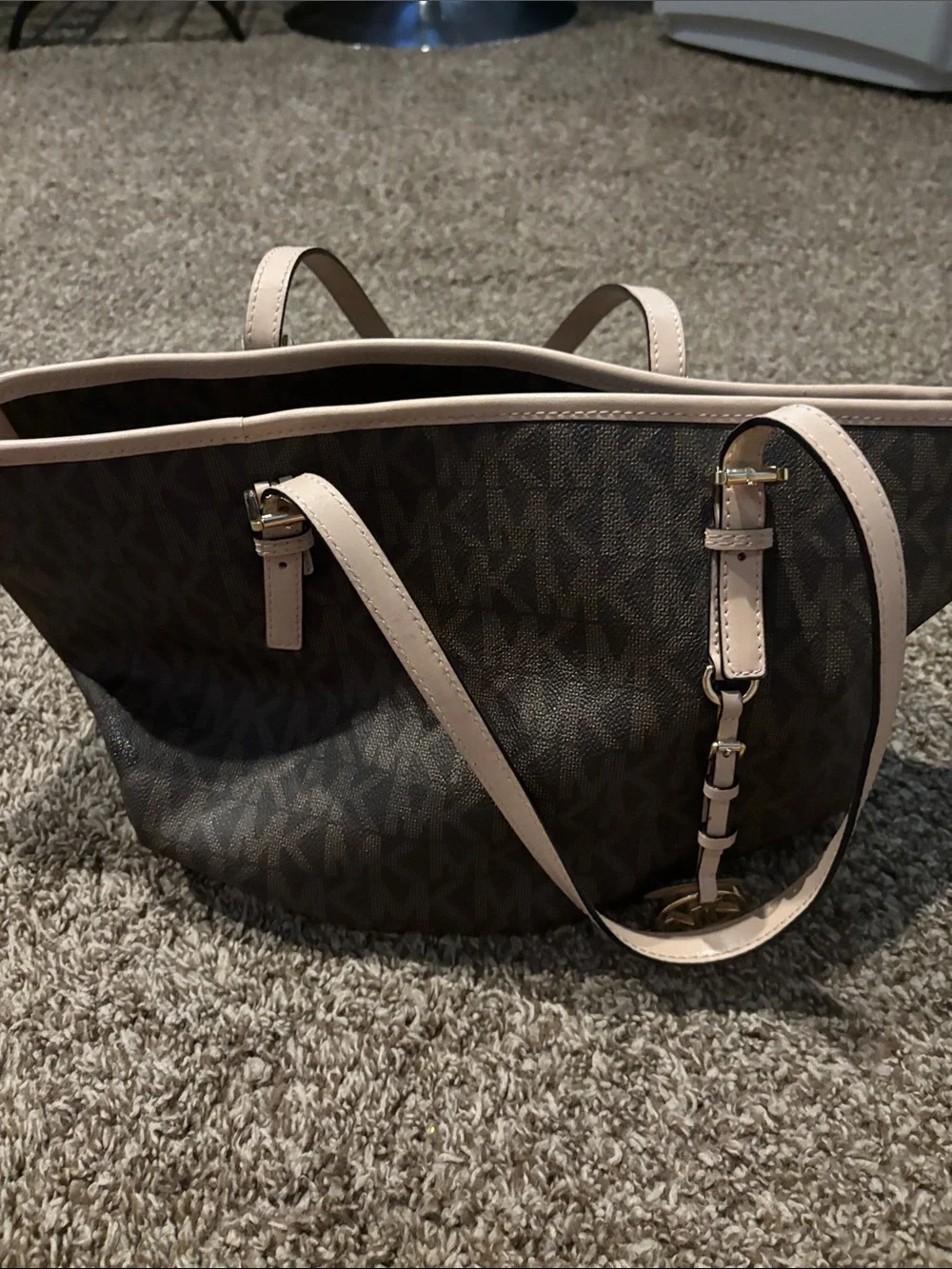 Michael Kors Brown Tote with tan trim does have some spots on inside